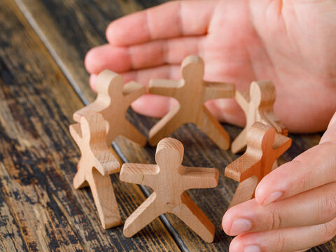 <a href="https://www.magnific.com/free-photo/business-success-concept-wooden-table-top-view-hands-protecting-wooden-figures-people_9426579.htm">Image by 8photo on Magnific</a>