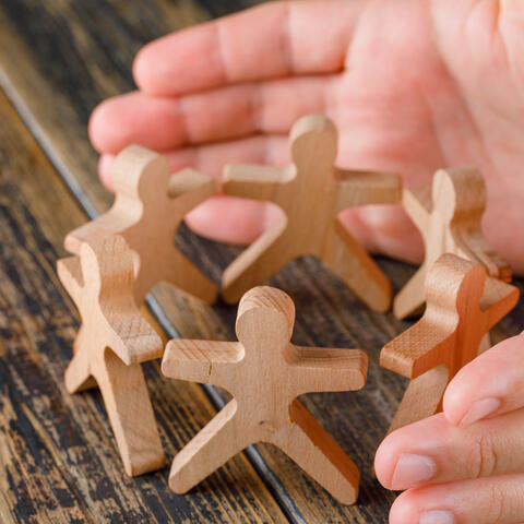 <a href="https://www.magnific.com/free-photo/business-success-concept-wooden-table-top-view-hands-protecting-wooden-figures-people_9426579.htm">Image by 8photo on Magnific</a>